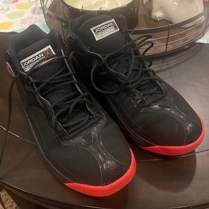 Men’s size 13 black and red Jordans.